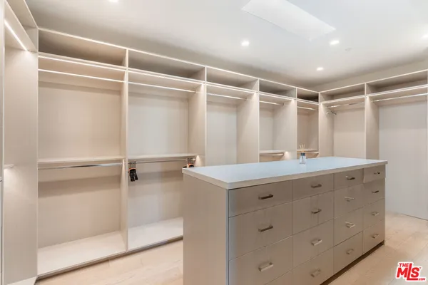 a bathroom with a shower sink and mirror