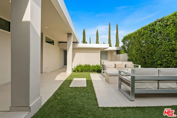 a view of a swimming pool with a patio