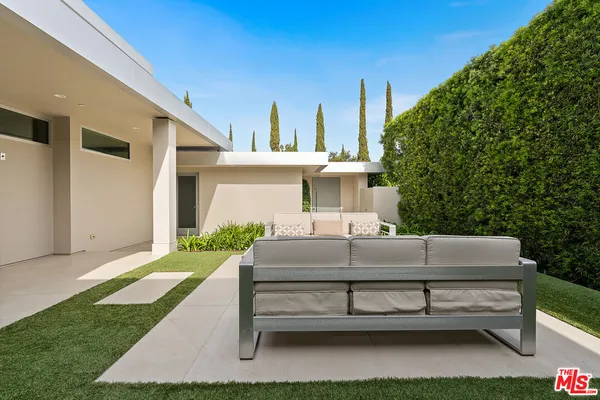 a view of a swimming pool with a patio