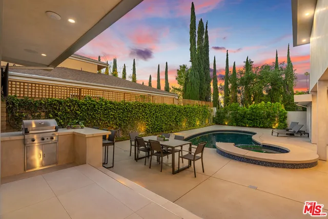 a patio with table and chairs