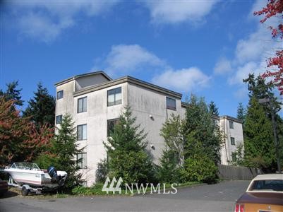712 North 143rd Street Seattle, WA 98133 - Photo 1 of 1 a view of a white house with a yard and plants