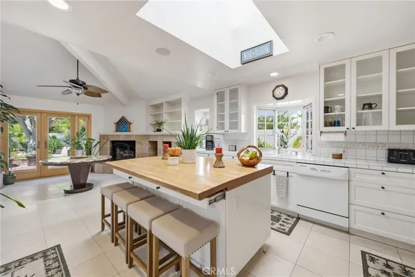 a dining room with furniture a window and wooden floor