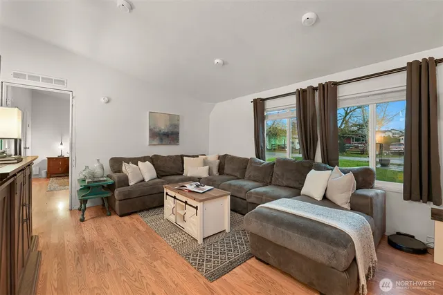 a living room with furniture and a large window