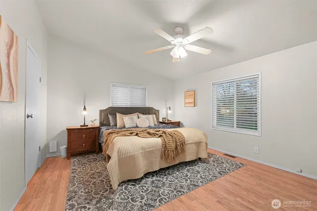 a bedroom with a bed and a window