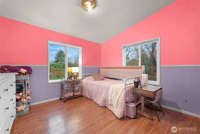 a bed room with a bed and a chair