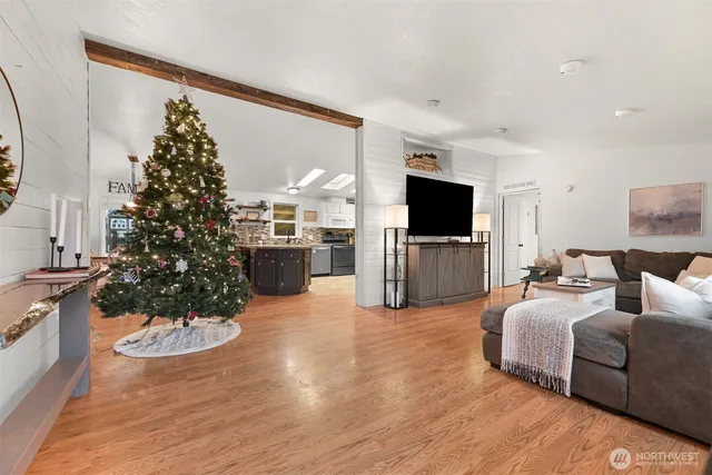 a living room with fireplace furniture and a flat screen tv