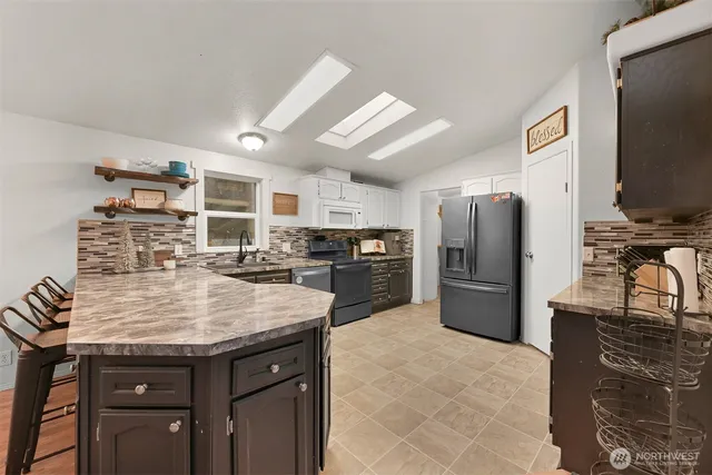 a kitchen with refrigerator and countertop