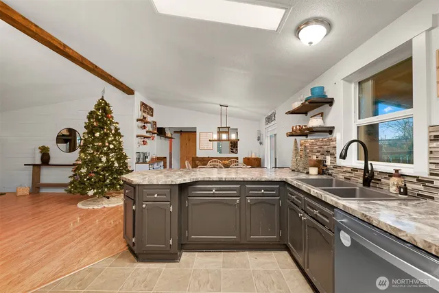 a kitchen with a sink and cabinets