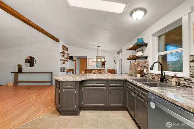 a kitchen with a sink and cabinets