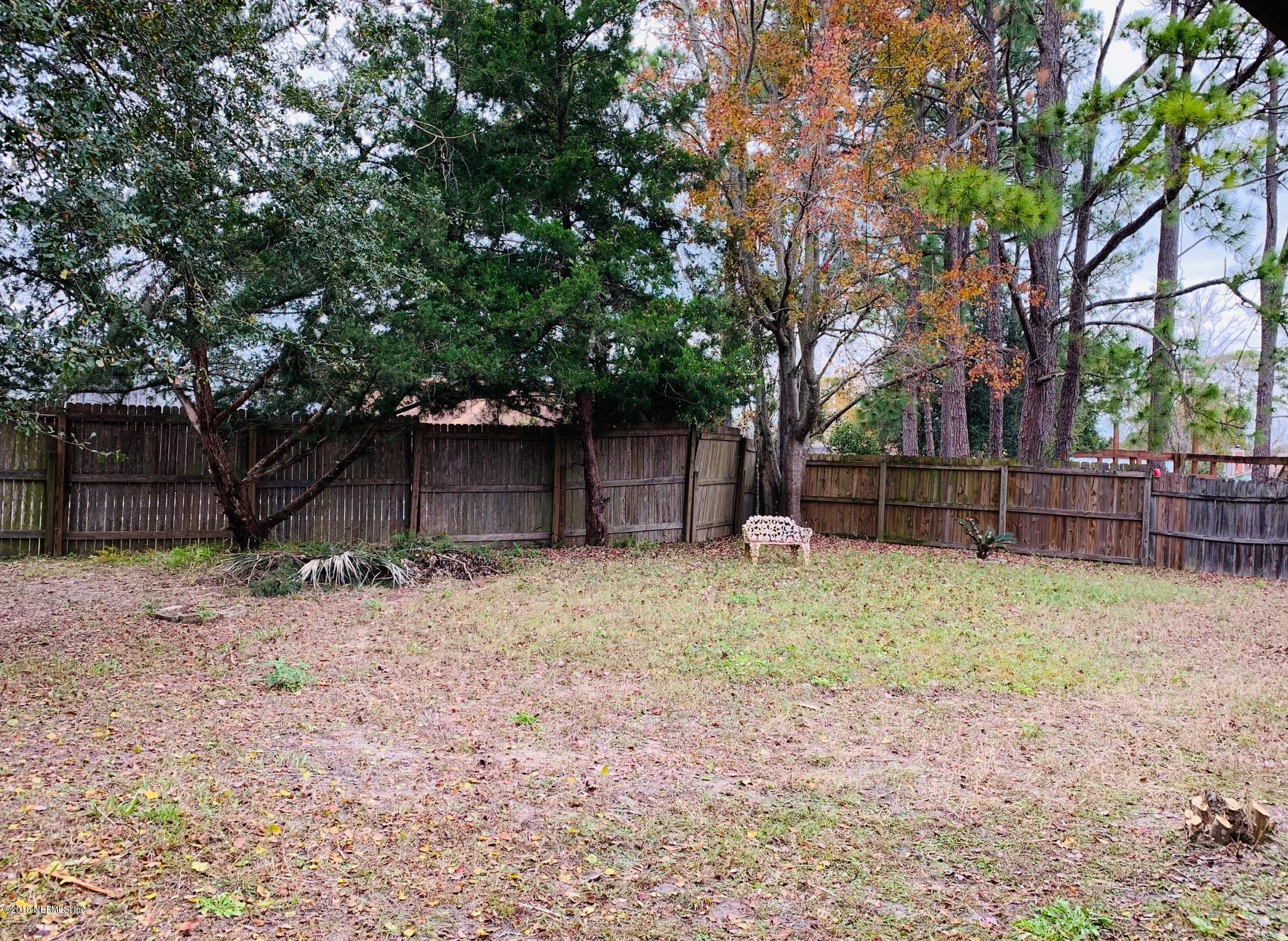 2526 Wattle Tree Road West Jacksonville, FL 32246 - Photo 18 of 19 a backyard of a house
