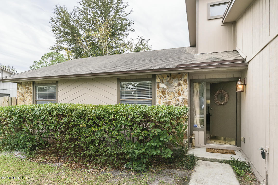 2526 Wattle Tree Road West Jacksonville, FL 32246 - Photo 3 of 19 a front view of a house with garden