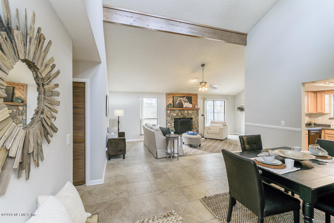 2526 Wattle Tree Road West Jacksonville, FL 32246 - Photo 5 of 19 a living room with furniture and a table