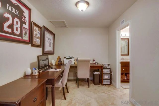 a view of a workspace with furniture