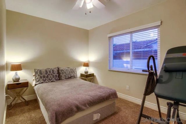 a bedroom with a bed and a chair