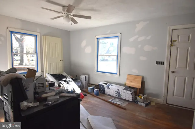 a bedroom with furniture and a window