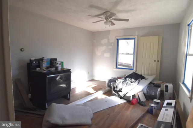 a bedroom with bed and a window