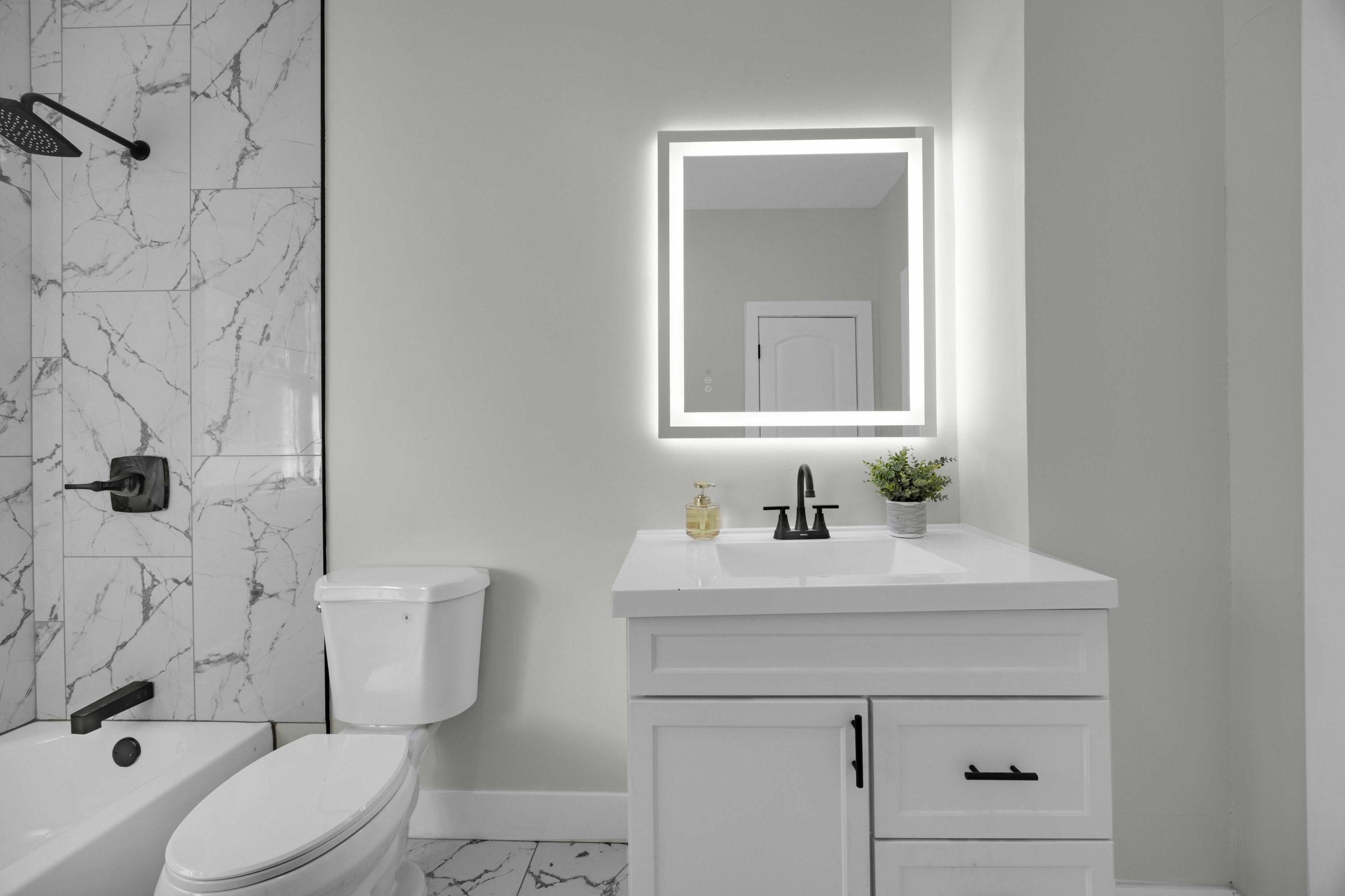 4200 Monroe Street Gary, IN 46408 - Photo 19 of 25 a bathroom with a sink vanity mirror and toilet