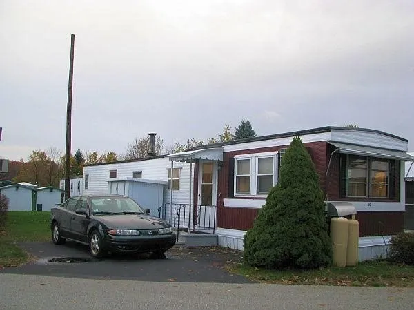 a view of a car parked in front of house