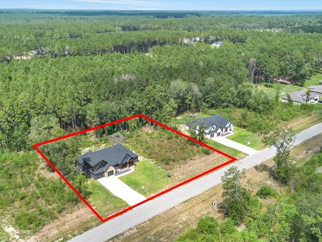 a view of a back yard of the house