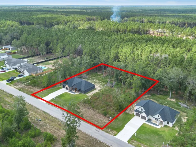 a view of a lush green space with sea