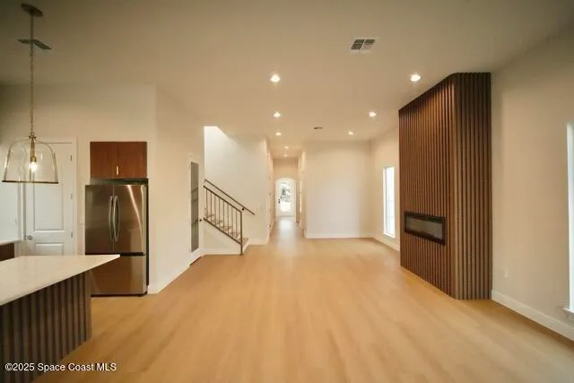 a kitchen with stainless steel appliances granite countertop a refrigerator and a sink