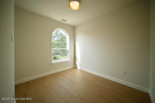 a white toilet sitting next to a bath tub