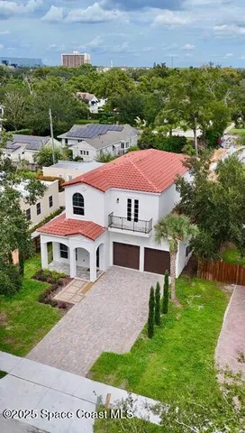 a view of a yard with a house in the background