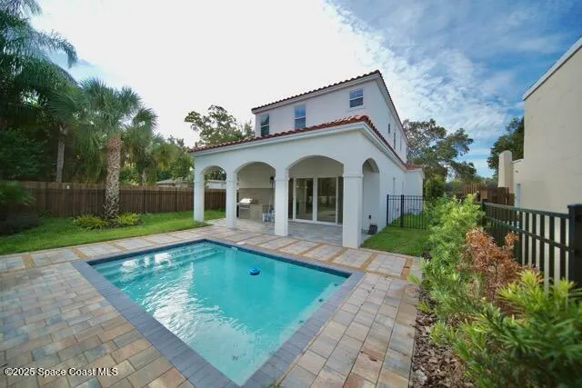a bathroom with a sink and mirror with toilet