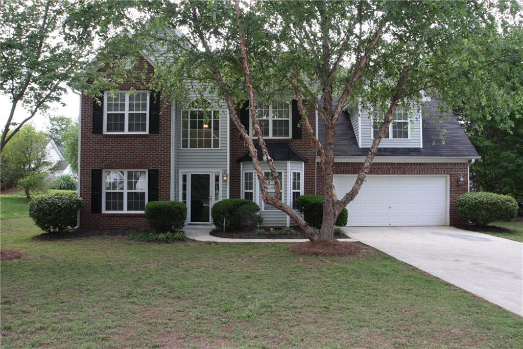 2551 Rainmaker Drive Decatur, GA 30034 - Photo 1 of 1 a front view of a house with garden