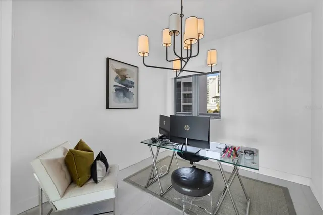 a view of a workspace with furniture