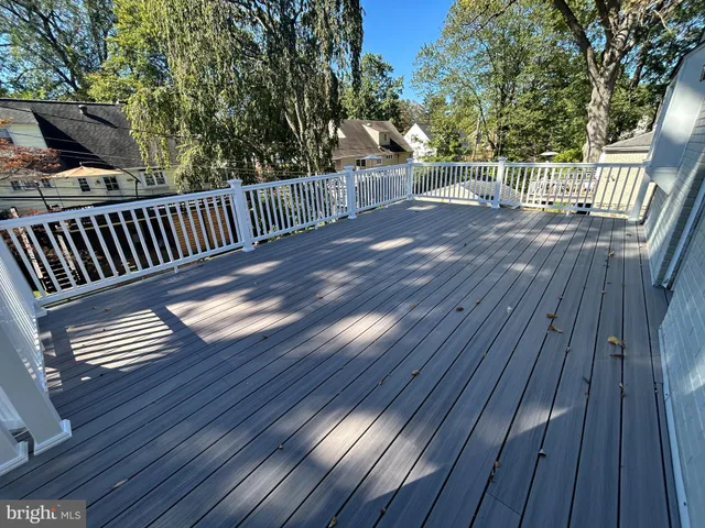 a view of balcony with wooden floor
