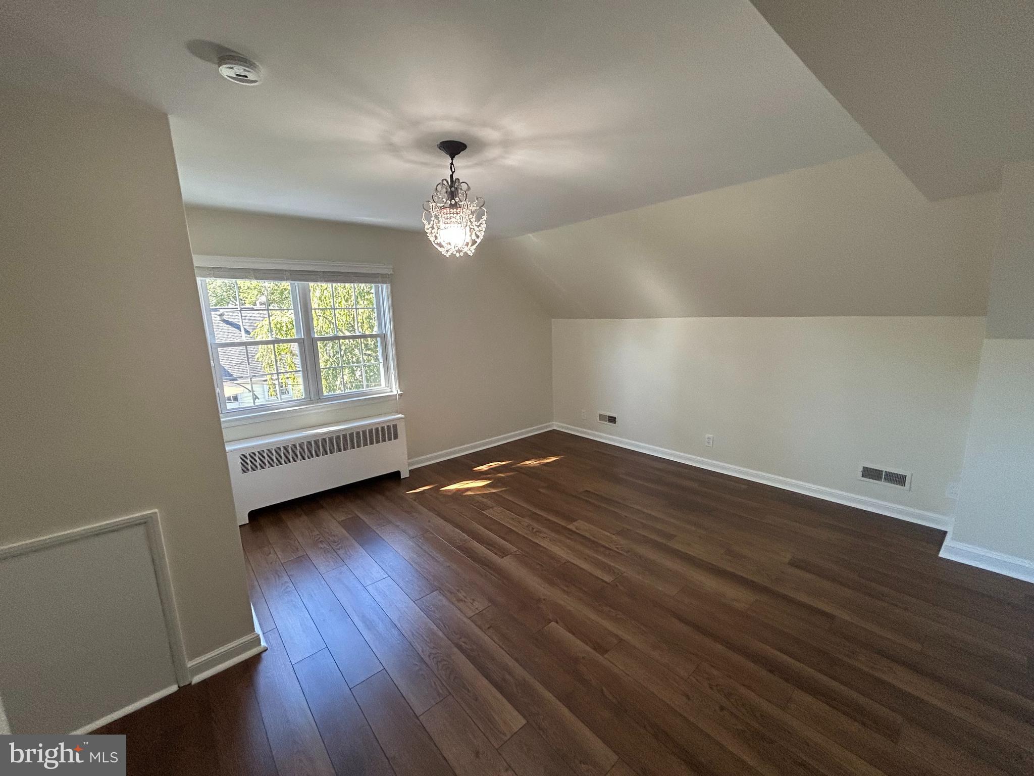 12 Rodney Road Bryn Mawr, PA 19010 - Photo 13 of 26 an empty room with wooden floor and windows