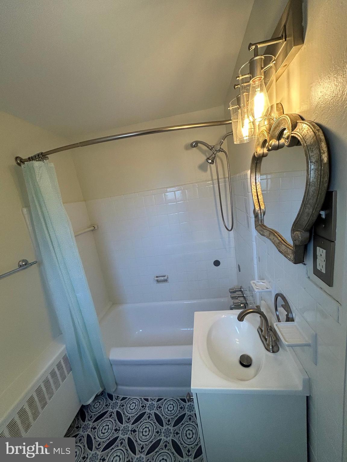 12 Rodney Road Bryn Mawr, PA 19010 - Photo 17 of 26 a bathroom with a sink and mirror with toilet