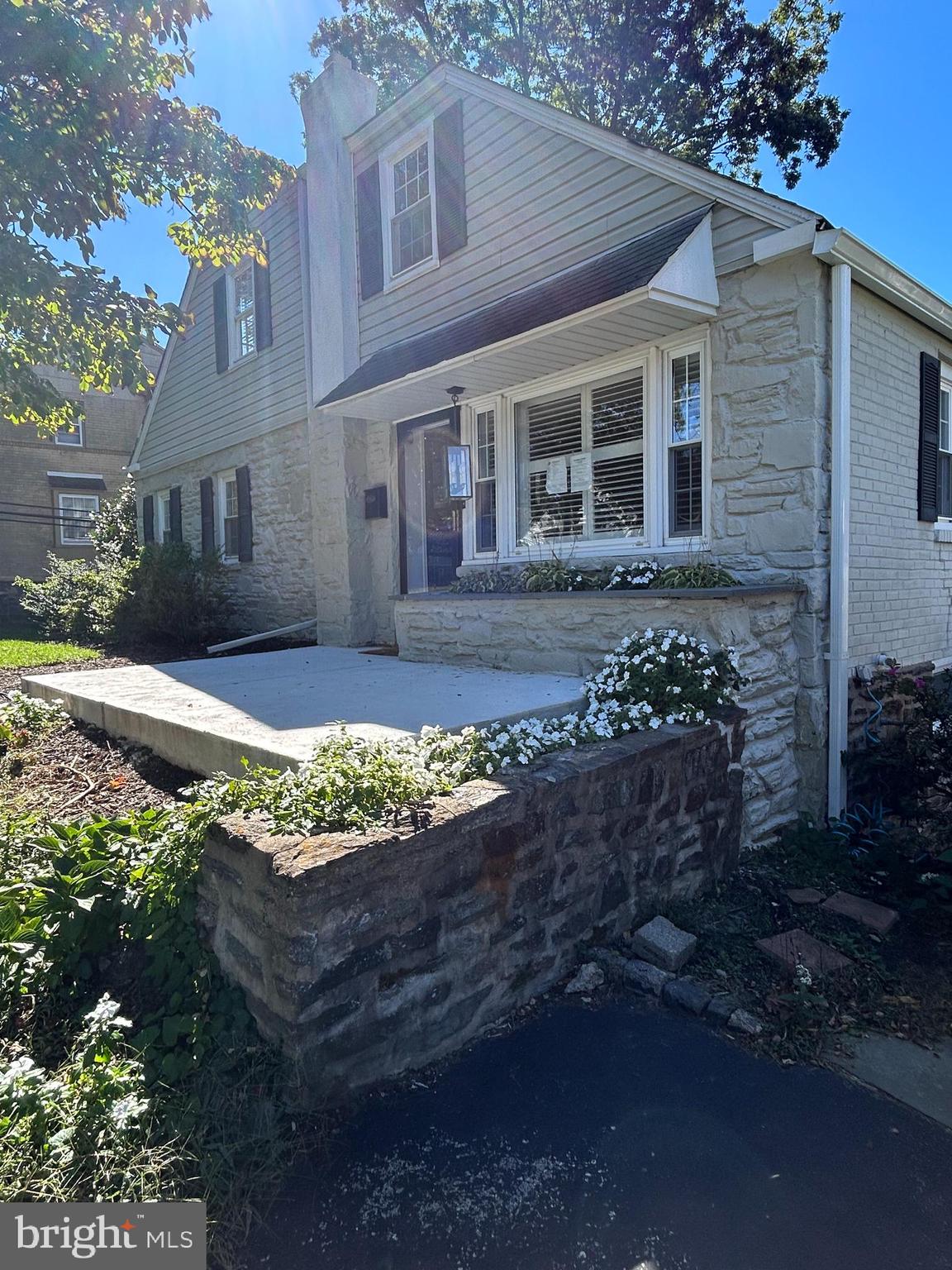 12 Rodney Road Bryn Mawr, PA 19010 - Photo 2 of 26 front view of a house with a yard