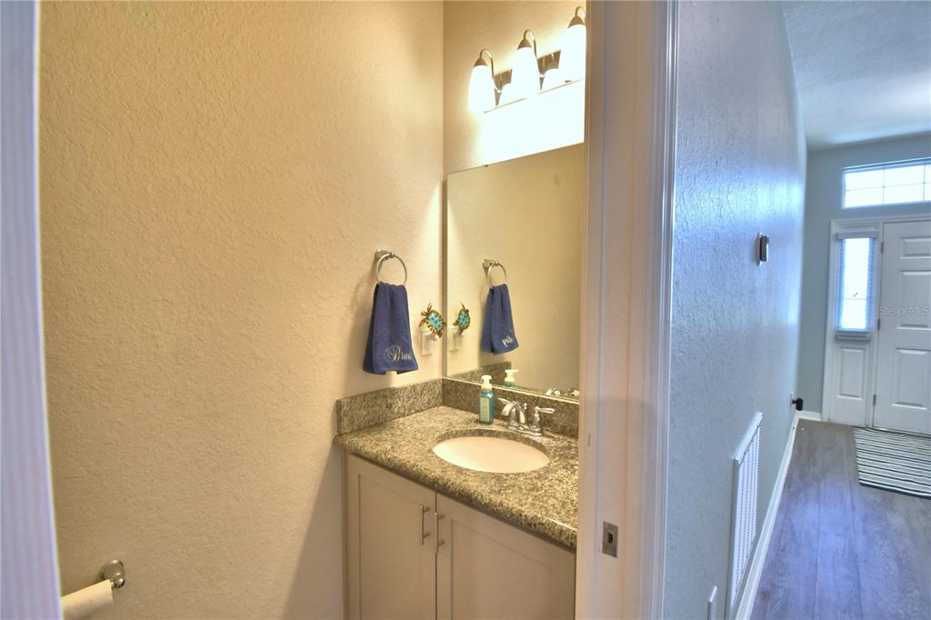 4340 Reding Way Lakeland, FL 33813 - Photo 24 of 63 a bathroom with a granite countertop sink and a mirror