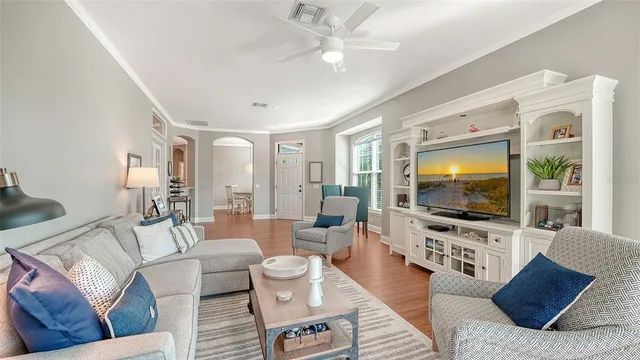a view of a dining room with furniture and wooden floor