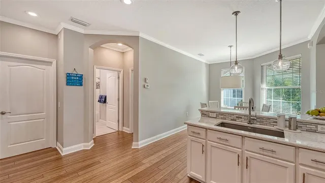 a view of a room with a window and wooden floor