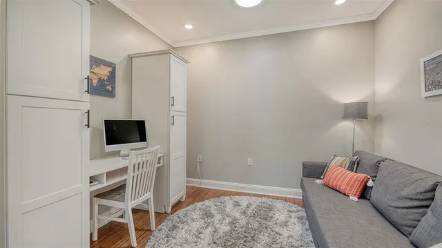 a bedroom with a bed and a flat screen tv in a dresser