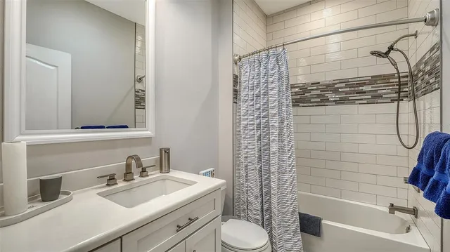 a view of a lake with houses in the background