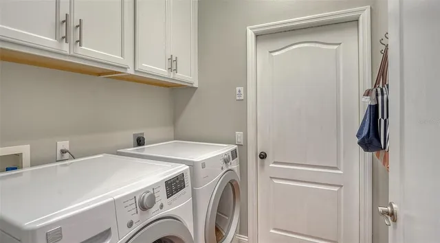 an aerial view of a house with a lake view
