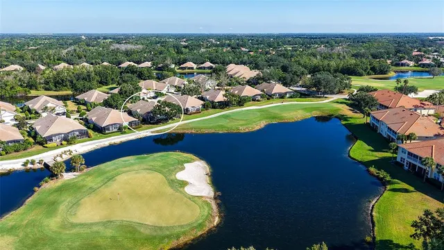 an aerial view of a house with a swimming pool yard and outdoor seating