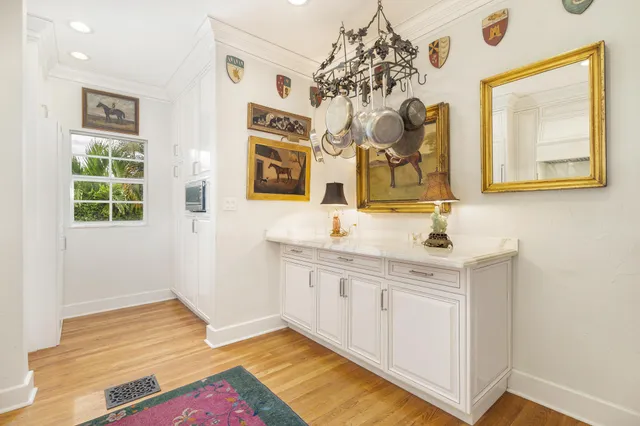 a bathroom with a sink mirror and vanity