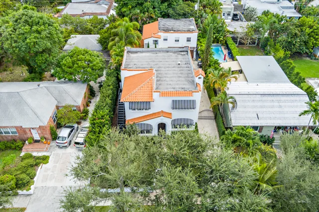 an aerial view of a house with a yard pool patio and outdoor seating