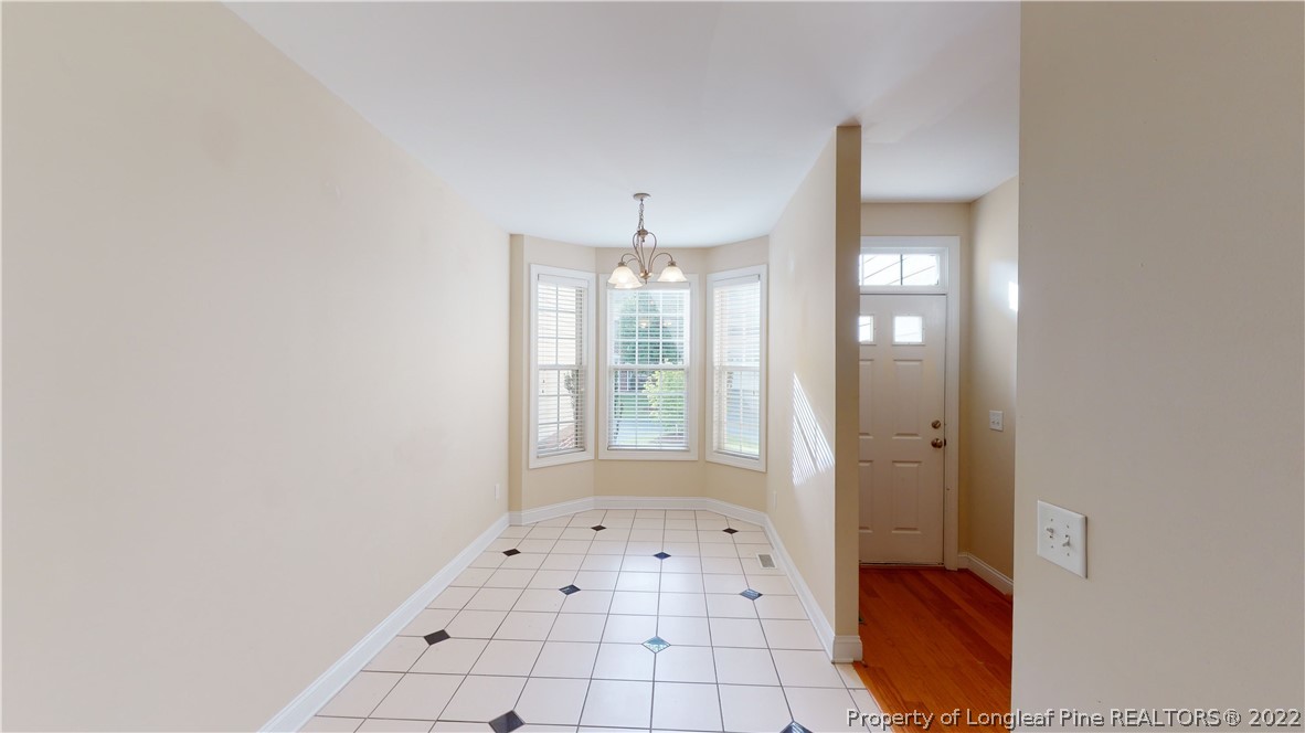 29 Hawk Ridge Drive Spring Lake, NC 28390 - Photo 13 of 33 a view of an empty room with window and chandelier fan