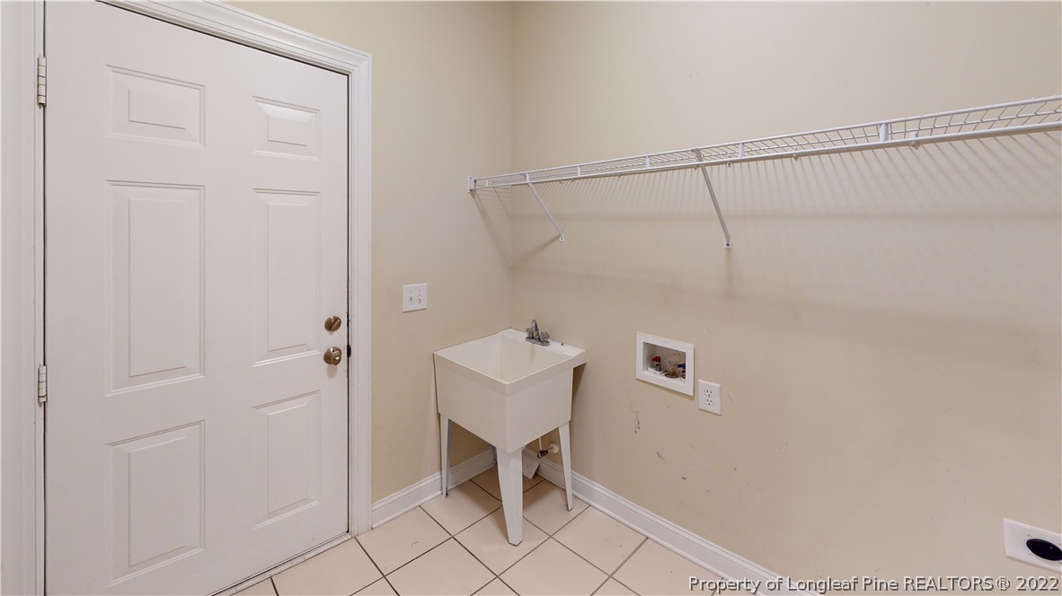 29 Hawk Ridge Drive Spring Lake, NC 28390 - Photo 15 of 33 a bathroom with a shower and a sink