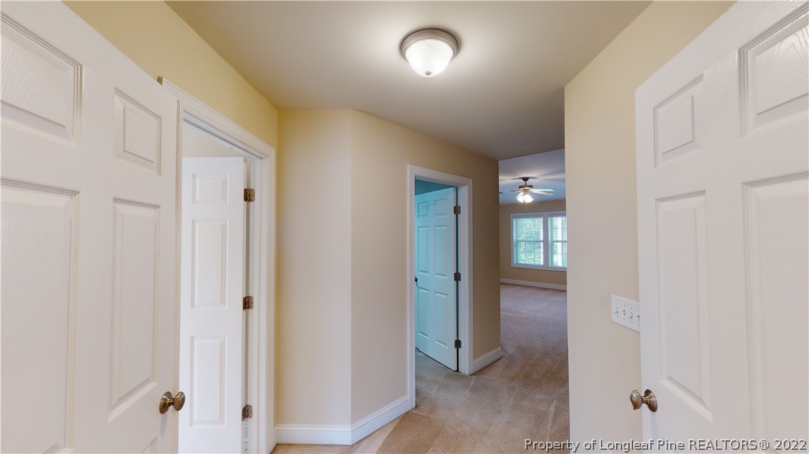 29 Hawk Ridge Drive Spring Lake, NC 28390 - Photo 19 of 33 a view of a hallway with wooden floor