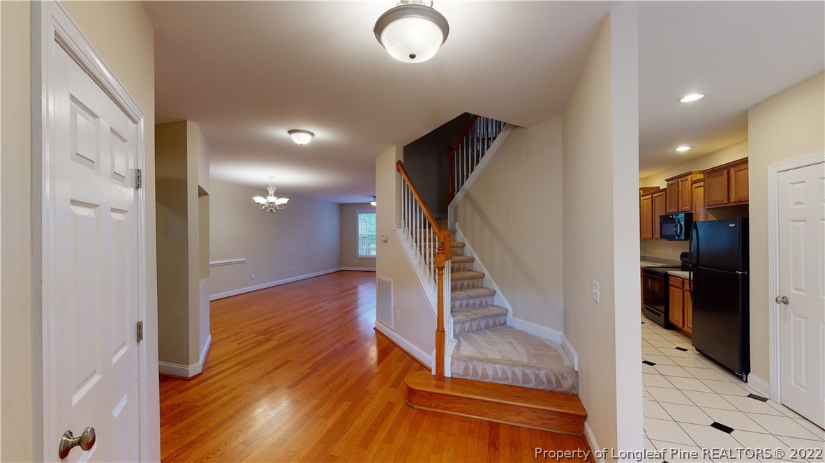29 Hawk Ridge Drive Spring Lake, NC 28390 - Photo 2 of 33 a view of entryway and hall with wooden floor