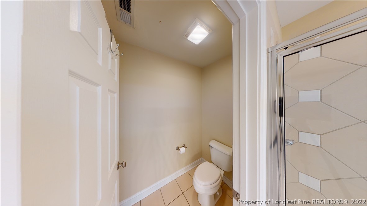 29 Hawk Ridge Drive Spring Lake, NC 28390 - Photo 22 of 33 a bathroom with a granite countertop shower and a toilet