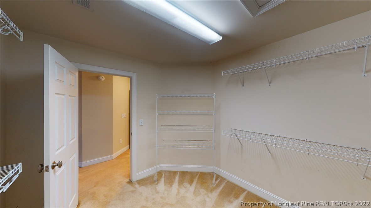 29 Hawk Ridge Drive Spring Lake, NC 28390 - Photo 24 of 33 a view of walk in closet with empty racks