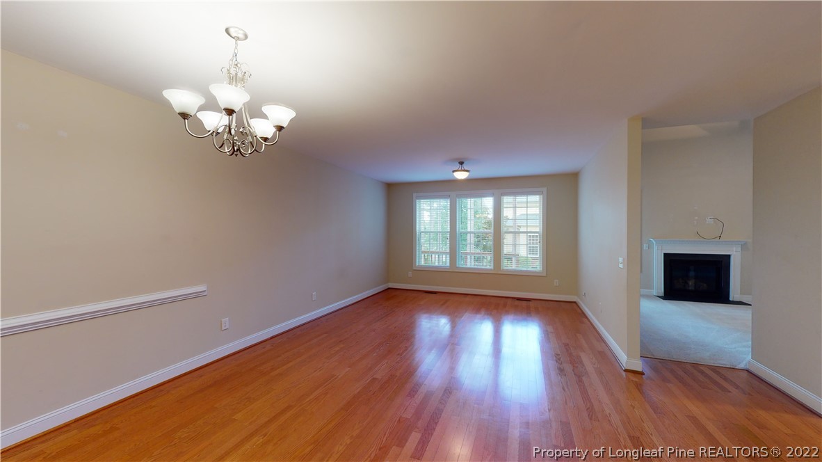 29 Hawk Ridge Drive Spring Lake, NC 28390 - Photo 3 of 33 wooden floor in an empty room with a window